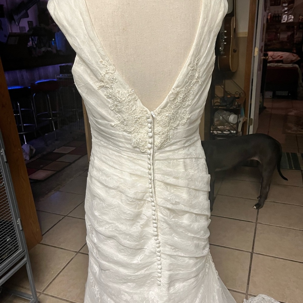 Wedding dress size12, only wore once. good condition asking $300